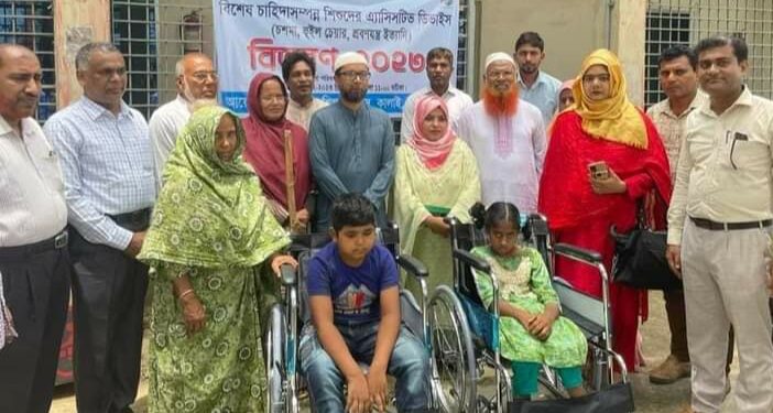 কালাইয়ে প্রতিবন্ধীদের মাঝে হুইল চেয়ার বিতরন